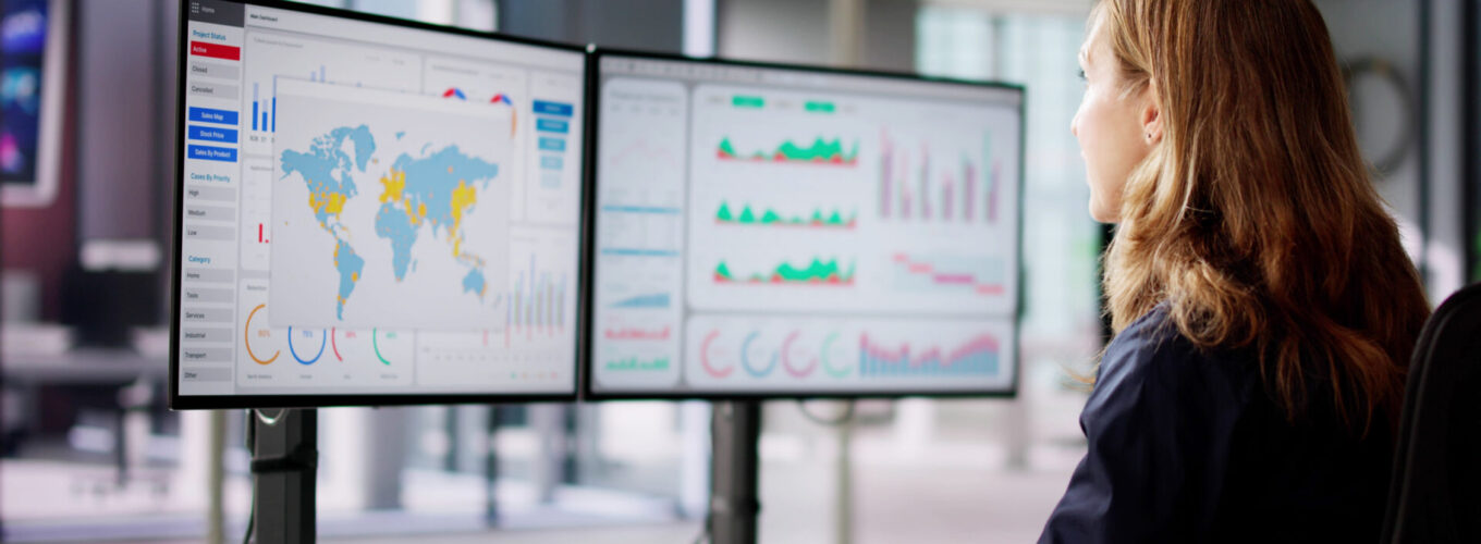 Business Woman Looking At Data Analysis Dashboard On Computer