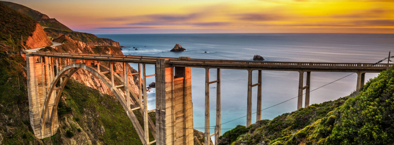 Bixby Bridge (Rocky Creek Bridge) and Pacific Coast Highway at sunset near Big Sur in California, USA. Long exposure.